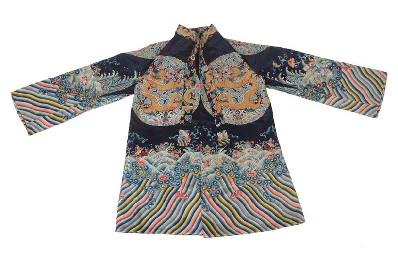 Inline Image - A small Chinese silk jacket, re-tailored from a 19th century imperial workshop embroidery, and a surcoat robe that has been completely re-shaped and adapted into a modern jacket. Sold at Dreweatts on 16 May 2017 for £5,208