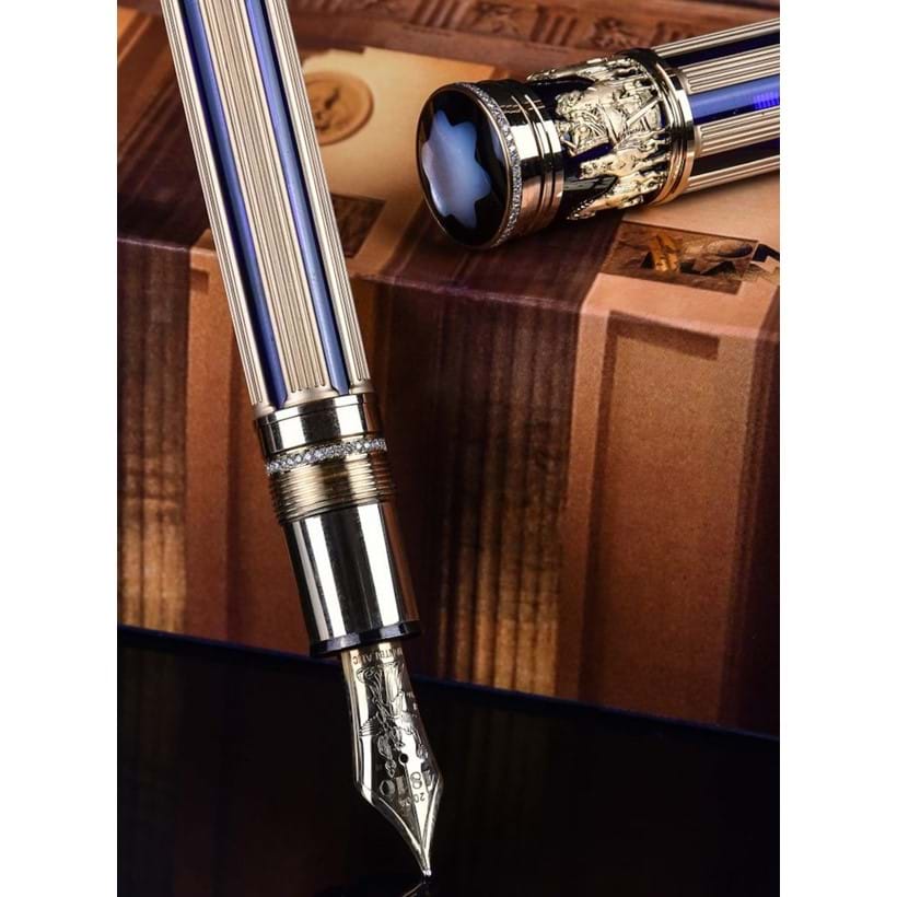Inline Image - Brandenburger Tor, 89, limited edition gold coloured, blue lacquer and diamond fountain pen, no. 88/89, circa 2004, stamped 750, the cap, piece and end of barrel set with a row of diamonds, the cap with a clip and mother of pearl emblem, the medium gold coloured nib stamped 18K 750, piston filling system, uninked, est. £8,000-12,000 (+fees)