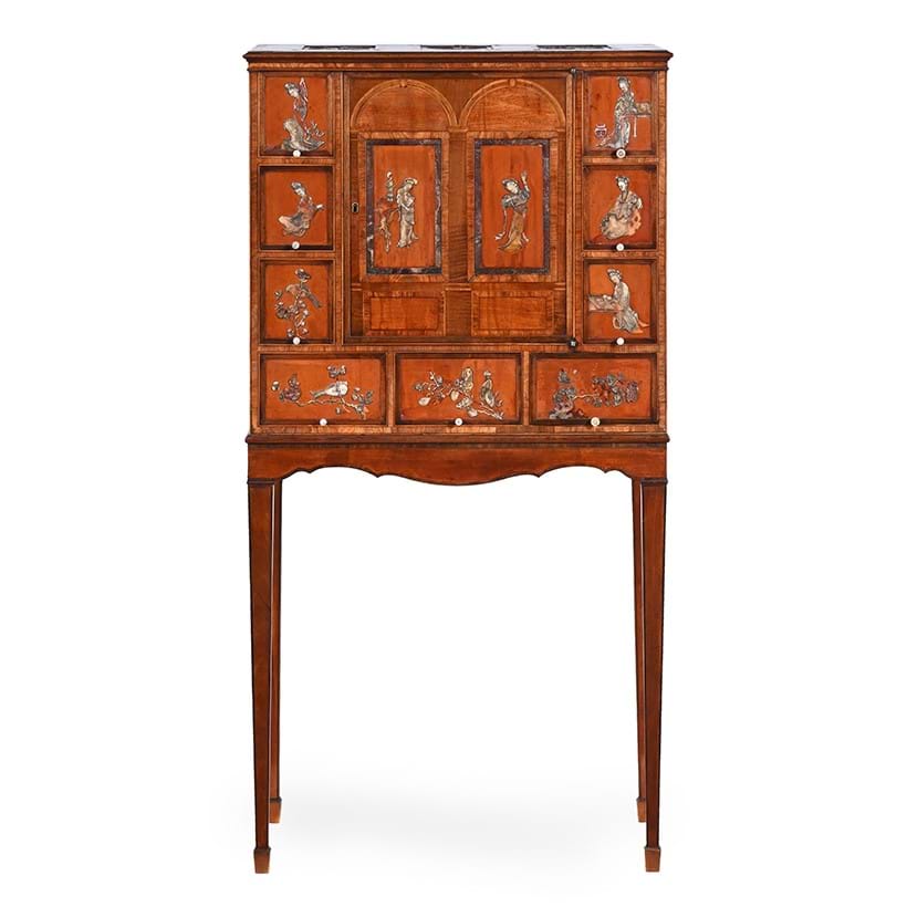 Inline Image - Lot 239: A George III satinwood and rosewood cabinet on stand, attributed to Ince & Mayhew, circa 1780 | Est. £6,000-8,000 (+ fees)