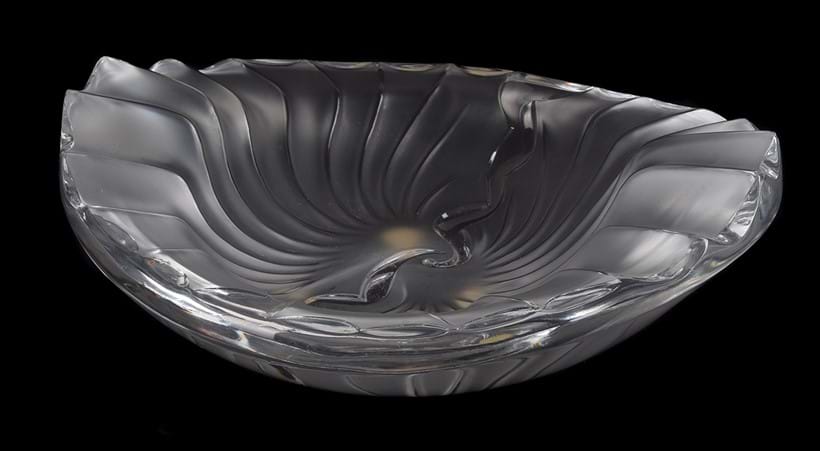 Inline Image - Lot 618: Lalique, Crystal Lalique, Nancy, a spiral fluted shallow oval dish, dated 16.11.90 | Est. £200-300 (+ fees)