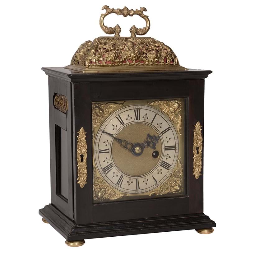 Inline Image - Lot 88: A fine James II gilt brass mounted ebony small basket top table timepiece with silent-pull quarter-repeat on two bells, Henry Jones, London, circa 1685-90 | Sold for £12,000 (+ fees)
