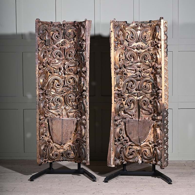 A large and impressive pair of Portuguese carved giltwood architectural elements, Porto, first quarter 18th century