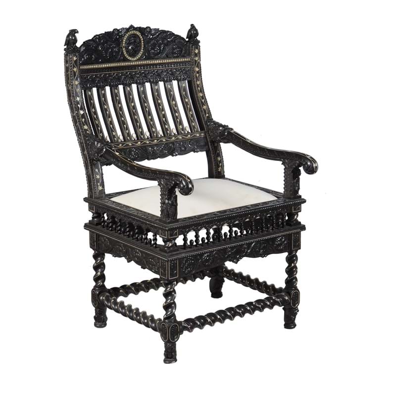  An Indian carved ebony and ivory inlaid armchair, late 17th century, Coromandel Coast 
