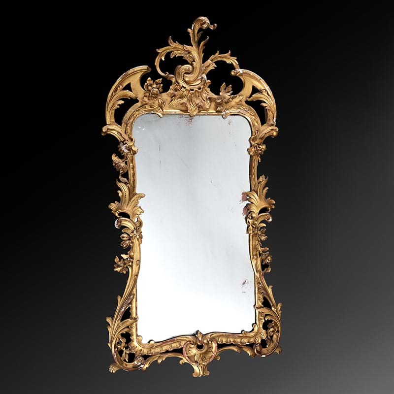 A carved giltwood wall mirror, in Irish George II style, 19th century