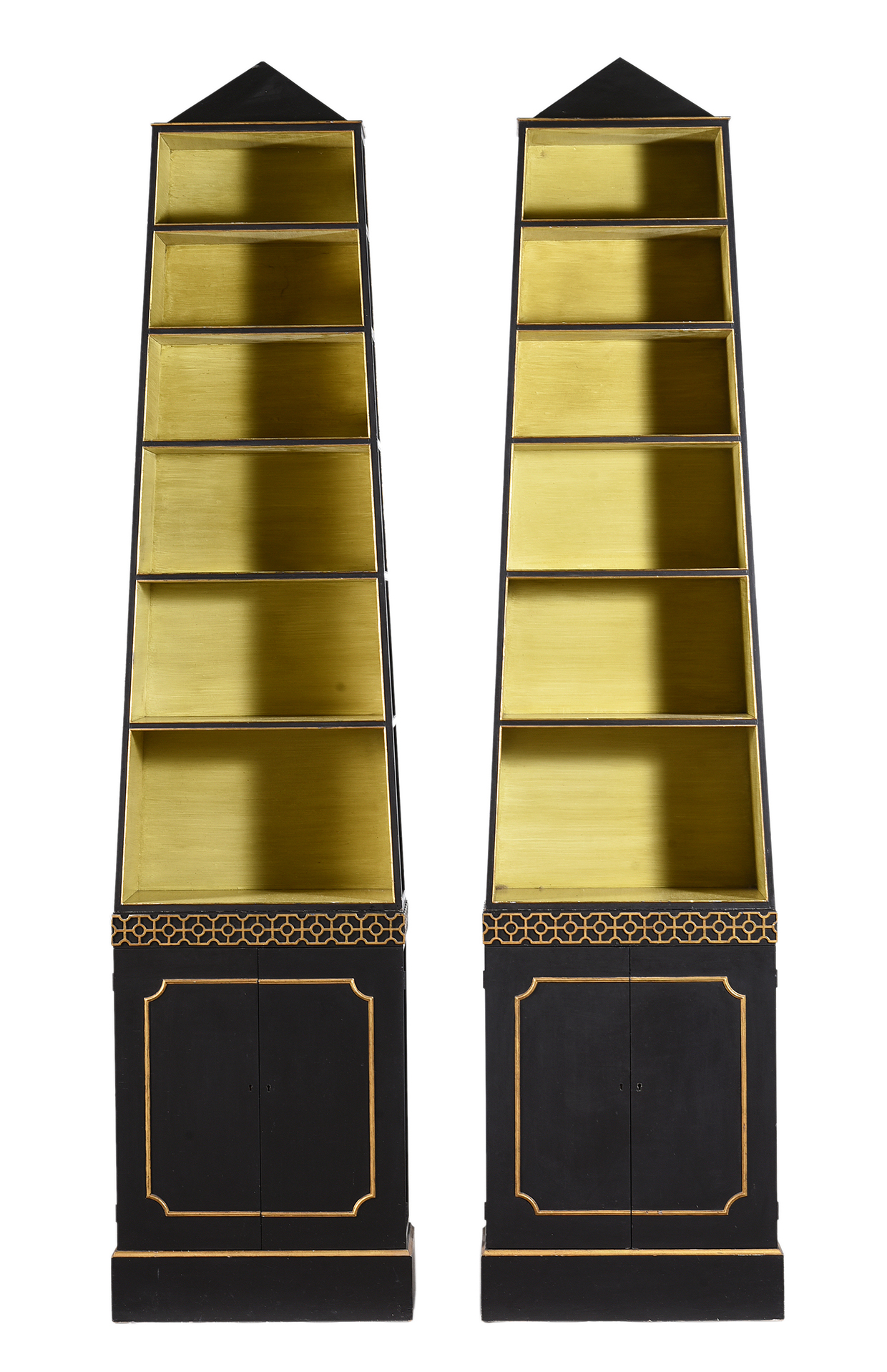 Inline Image - Lot 234: A pair of ebonised and parcel gilt 'pyramid' open bookcases, in Regency style, by John Fowler, mid 20th century | Est. £2,000-3,000 (+ fees)