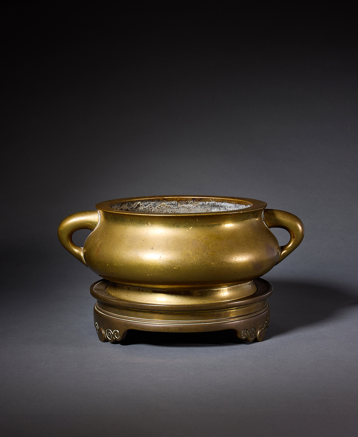 Inline Image - Lot 338: A Chinese bronze bombe censer and stand, Qing Dynasty, 18th century | Est. £4,000-6,000 (+ fees)