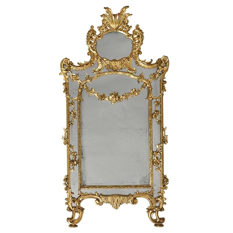 A large carved giltwood and composition wall mirror, in 18th century style, late 19th or early 20th century