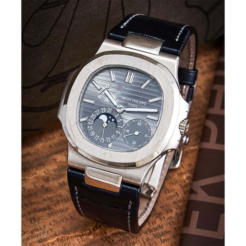 Y Patek Philippe, Nautilus, an 18 carat white gold wristwatch with date, moonphase and power reserve indicator, circa 2010