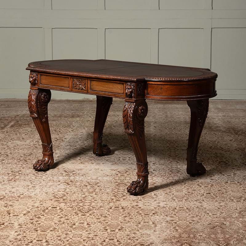 Y A fine George IV carved rosewood writing table, circa 1820