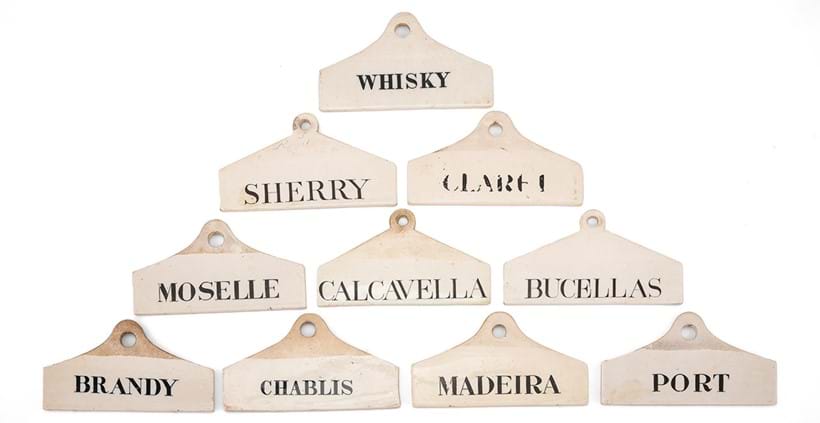 Inline Image - Lot 225: Ten various English pottery and creamware wine/bin labels including five Wedgwood examples and a W. & J. Burrow (of London & Malvern) example, various dates 19th century | Est. £700-1,000 (+ fees)