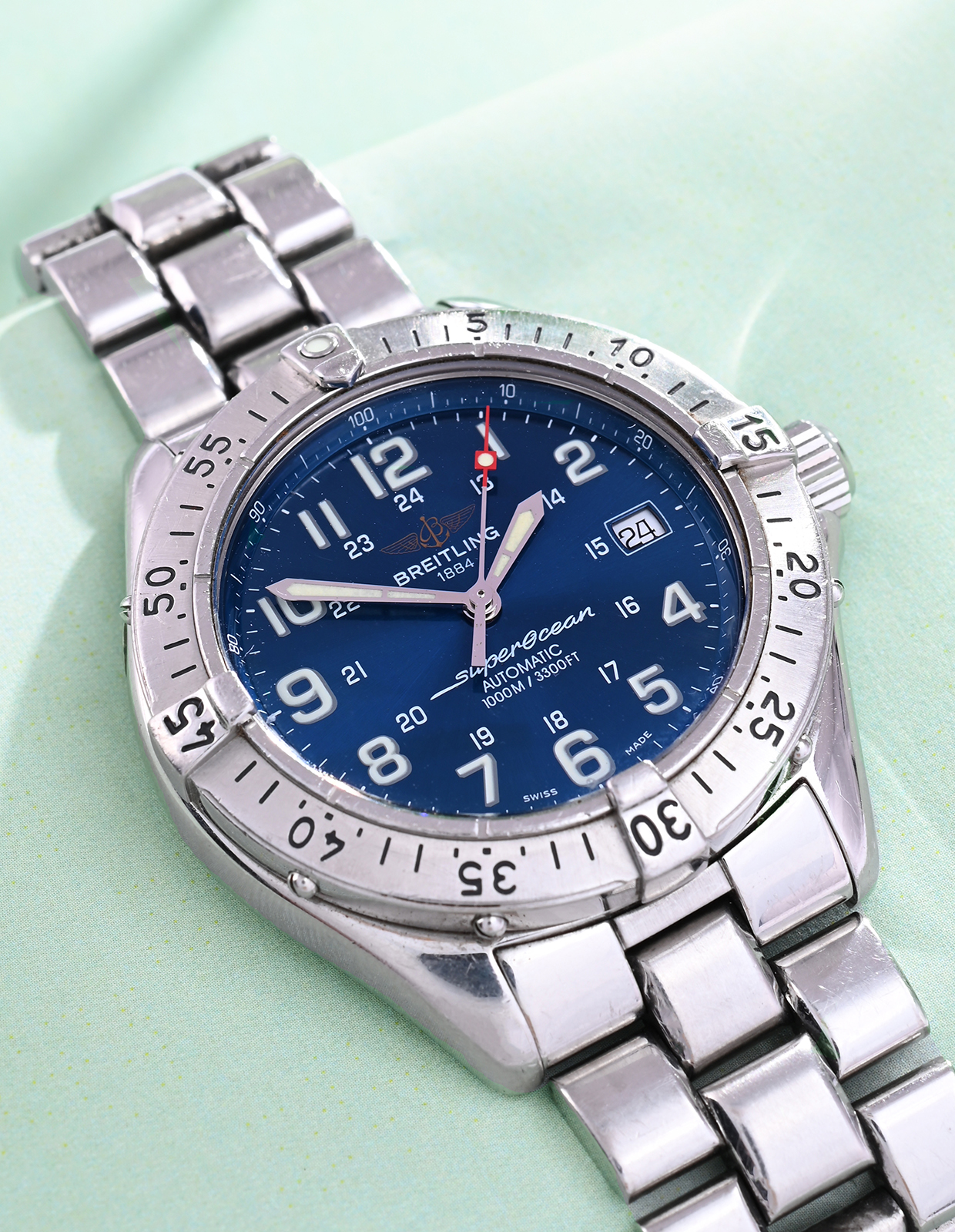 Inline Image - Lot 273: Breitling, Superocean, Ref. A17340, a stainless steel bracelet watch with date, No. 218017, circa 2000 | Est. £800-1,200 (+ fees)