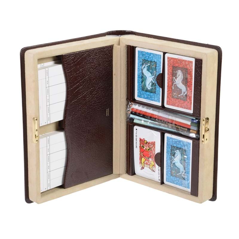 Asprey, a bridge set in the form of a leather book, containing four sets of cards, eight pencils and score sheets 