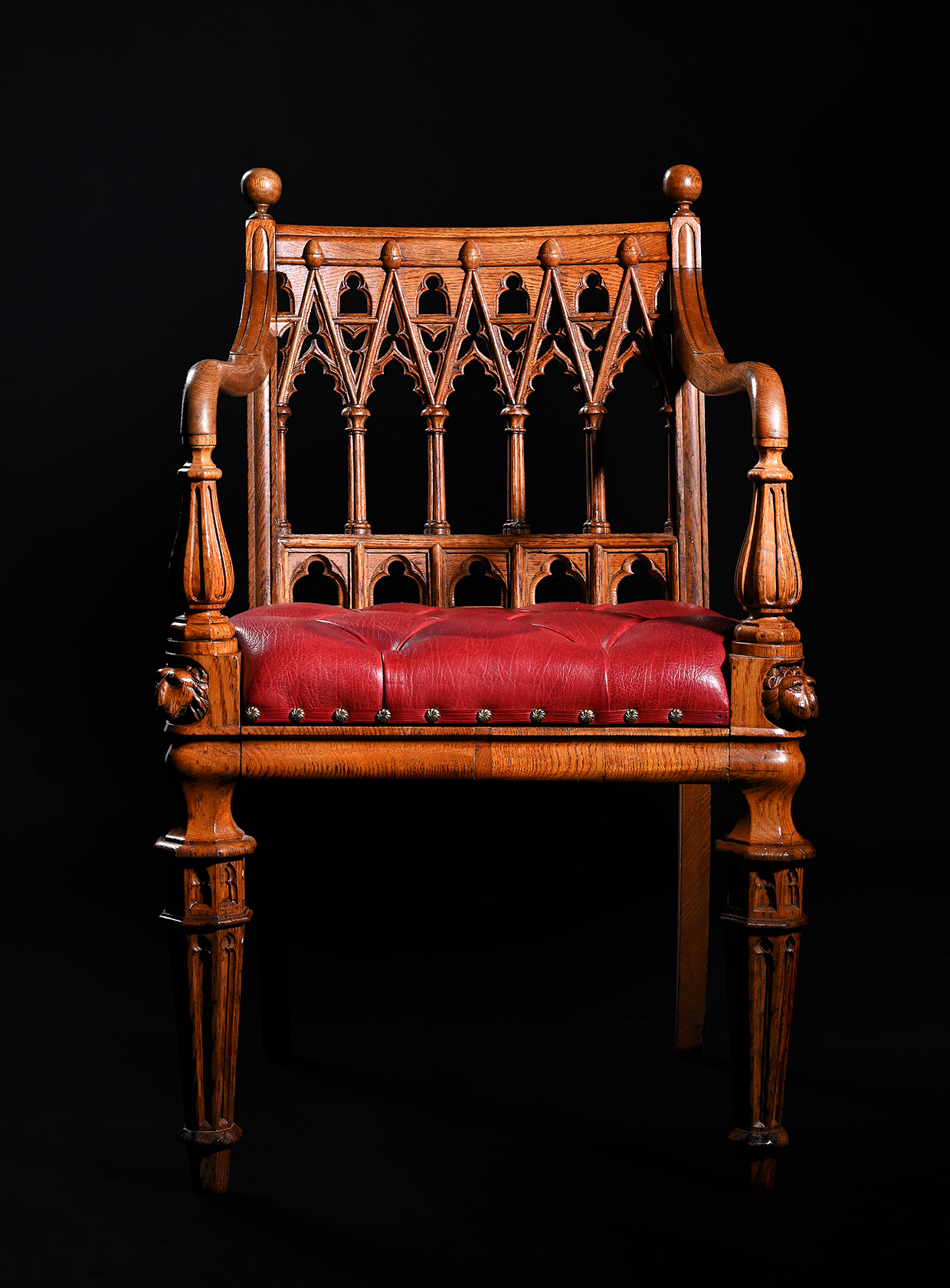 Inline Image - Lot 246: (Detail) A set of fourteen George IV oak dining chairs, in the manner of George Smith, in Gothic Revival taste, circa 1830 | Est. £7,000-10,000 (+ fees)