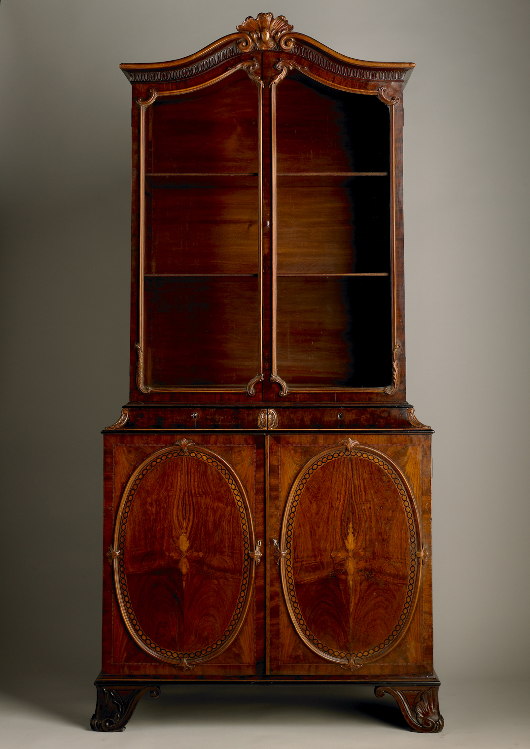 Inline Image - Lot 239: A George III mahogany, padouk, marquetry and ebonised bookcase designed by and attributed to John Linnell, circa 1765 | Est. £20,000-30,000 (+ fees)
