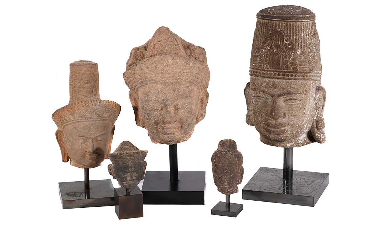 Lot 660 - A group of five carved stone heads, mostly Cambodian.jpg