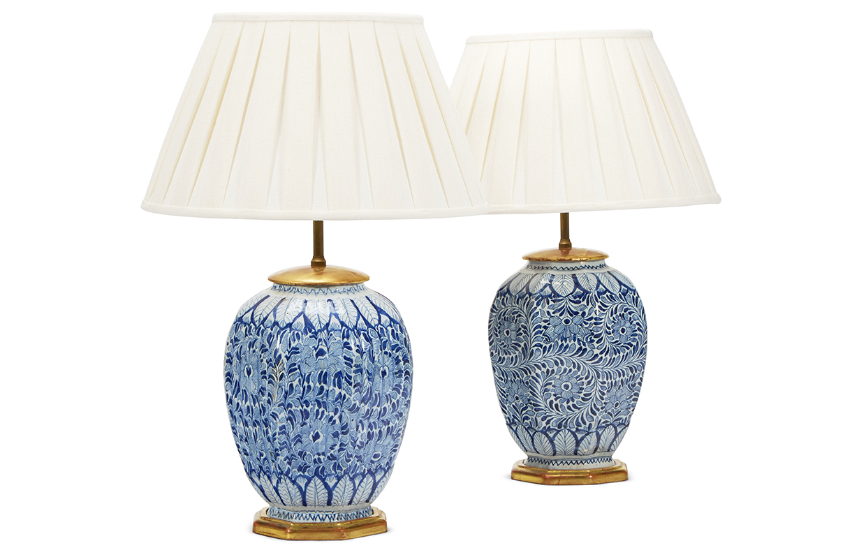 Sibyl Colefax & John Fowler auction - Lot 173 - Two similar delft blue and white facetted ovoid vases.jpg