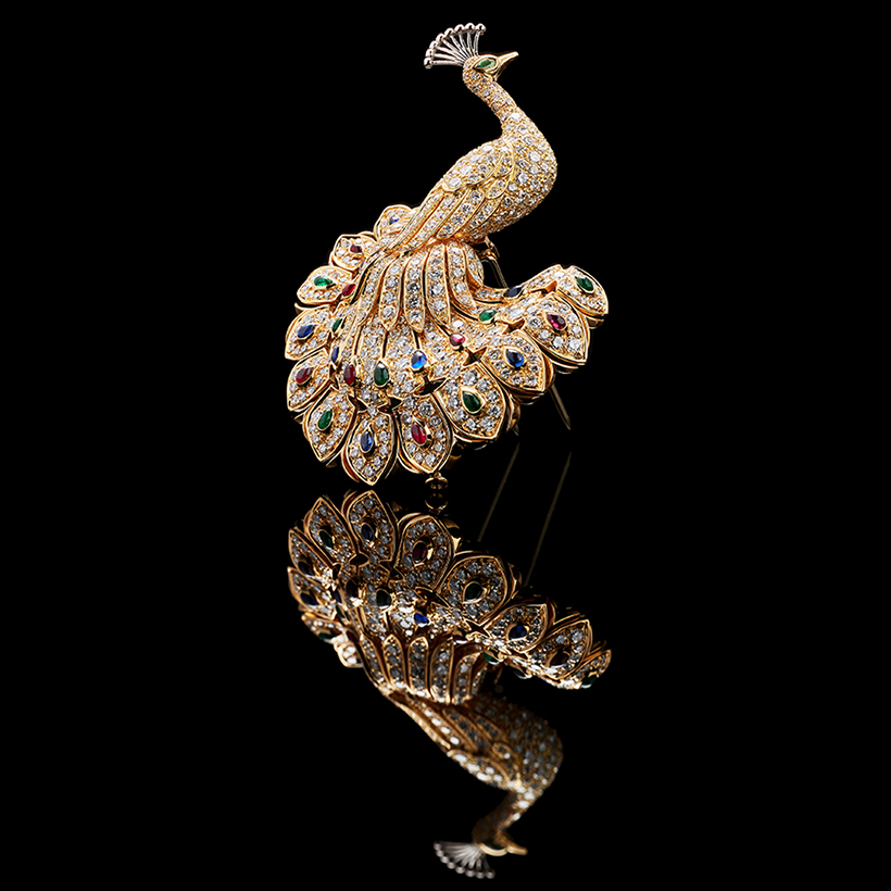 A diamond sapphire  ruby and emerald peacock brooch by Cartier.JPG