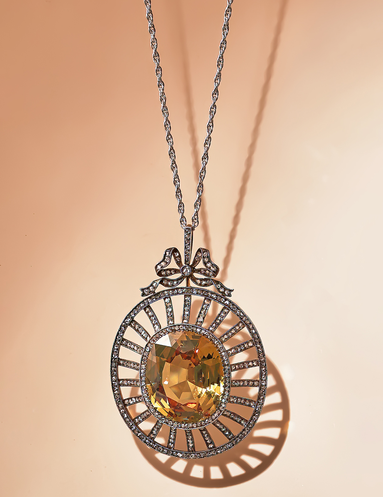 Inline Image - Lot 16: Fabergé, a yellow sapphire and diamond pendant, Odessa 1908-1917 | Sold for £43,950