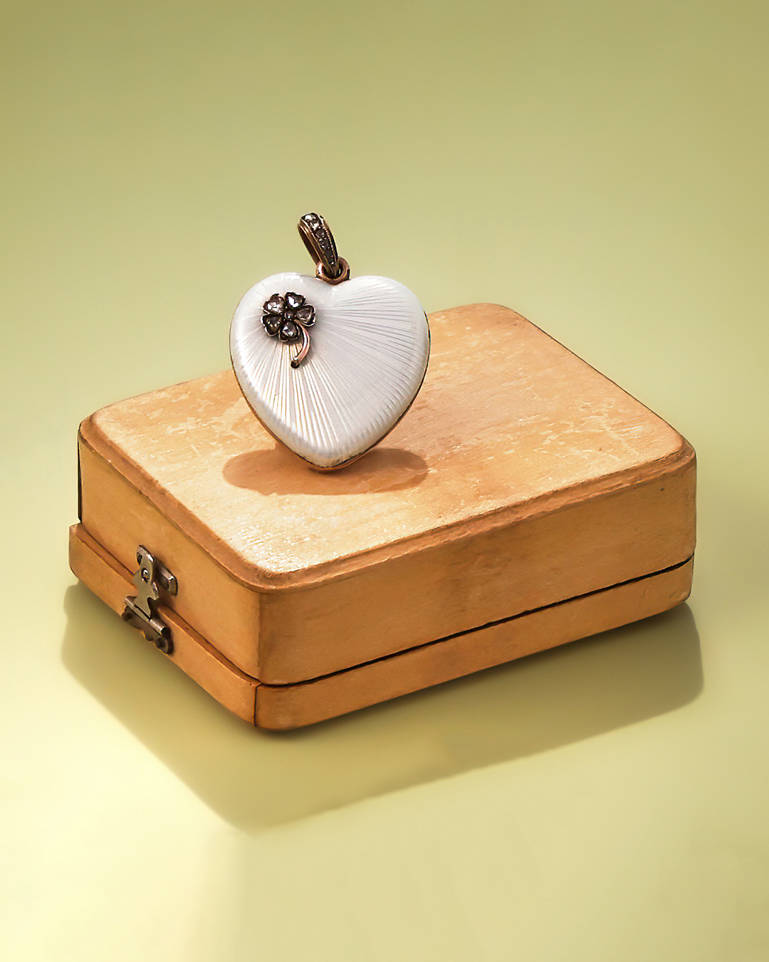 Inline Image - Lot 77: Fabergé, a diamond set enamel locket pendant, unmarked, St. Petersburg 1903-1914 | Sold for £22,680