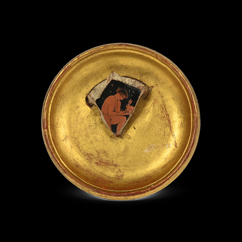 An attic red figure cup fragment attributed to the Eretria painter