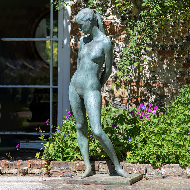 Nereo Quagliato (Italian 1939-2014) a patinated bronze of a standing nude female figure