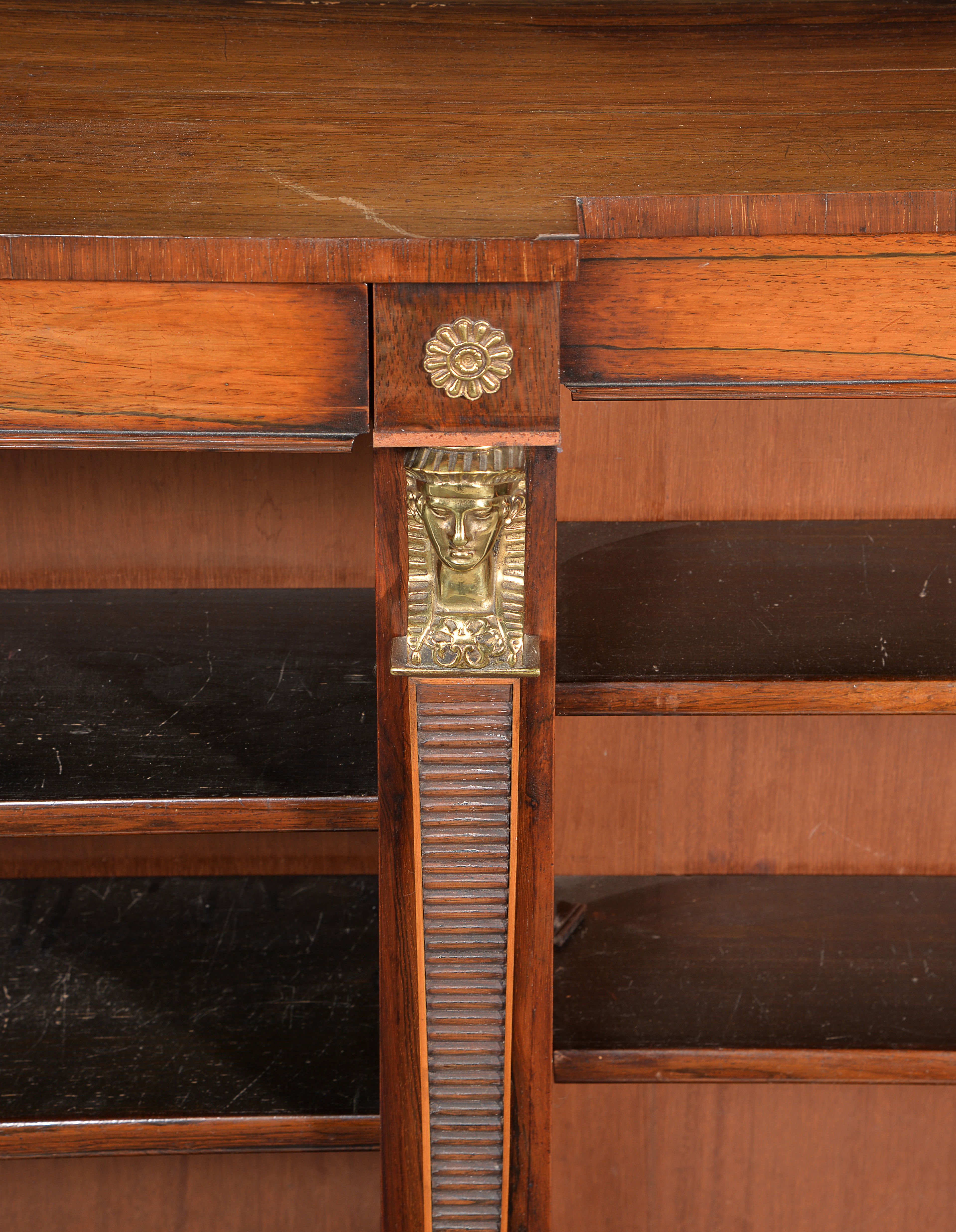 Inline Image - Lot 332: Y A rosewood and gilt metal mounted open bookcase in Egyptian Revival taste, mid-19th century | Est. £400-600 (+fees)