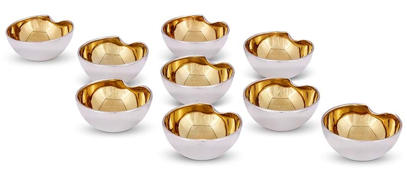 Inline Image - Nine Italian Silver Thumbprint Salt Cellars, Elsa Peretti for Tiffany & Co. import marked for London 2002 | Sold for £3,250