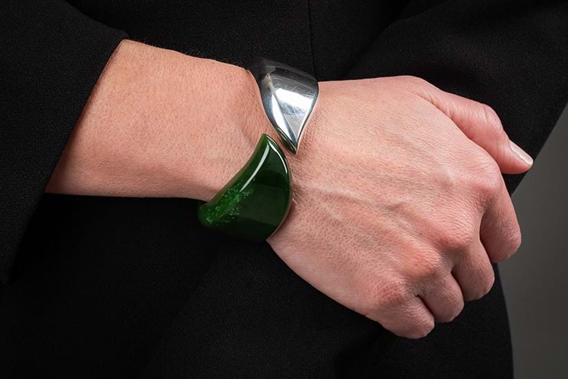 Inline Image - Elsa Peretti for Tiffany & Co., Feather Cuff, a green nephrite jade and silver hinged bangle | Sold for £2,016