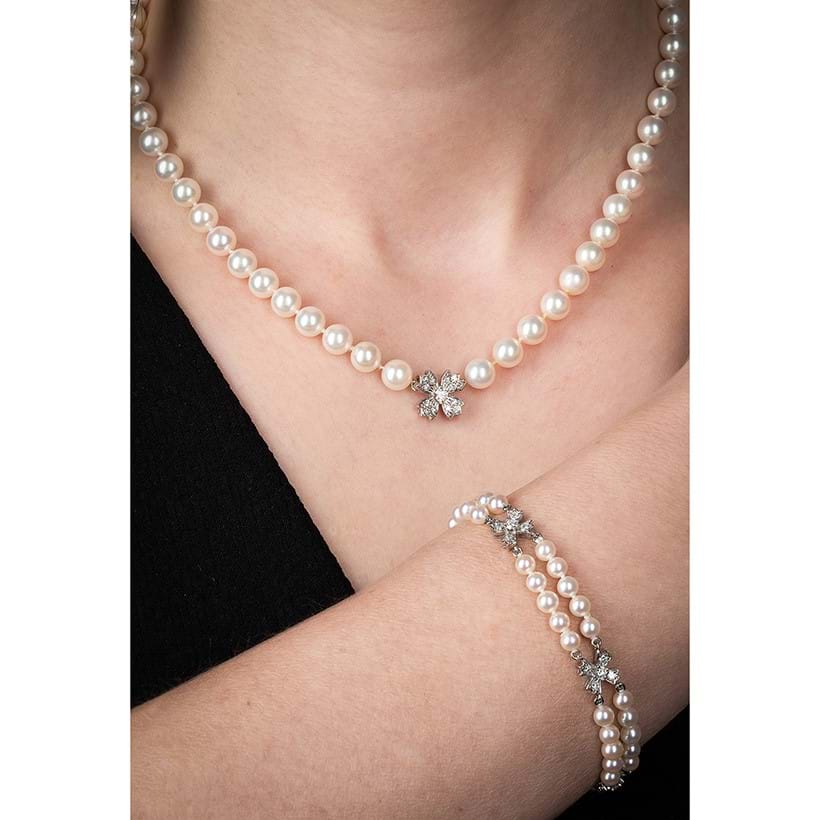 Inline Image - Tiffany & Co., floret flourishes, a diamond and cultured pearl necklace and bracelet, 2000 & 2001 | Sold for £3,276
