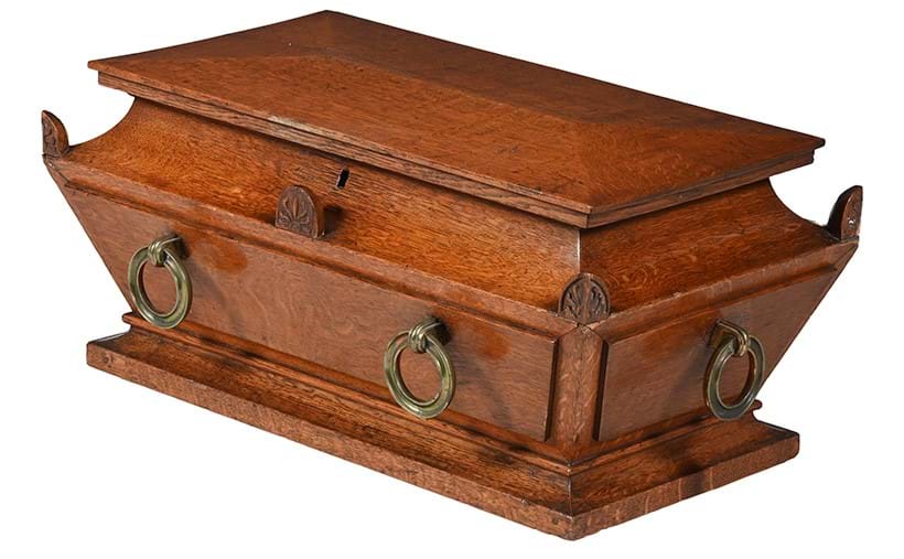 Inline Image - Lot 1103: a George IV Oak Sarcophagus-shaped Wine Cooler, first half 19th century | Est. £700-1,000 (+ fees) | |Auction date: 29 May 2025