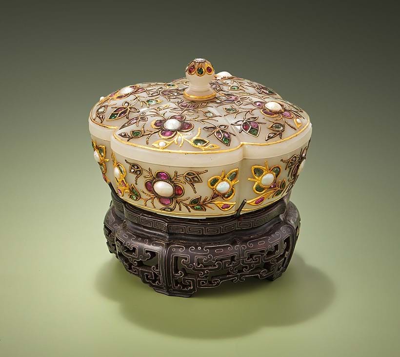 Inline Image - Lot 45: A pale celadon or white jade gem-set quatrefoil box and cover, 18th/19th century | Sold for £38,950
