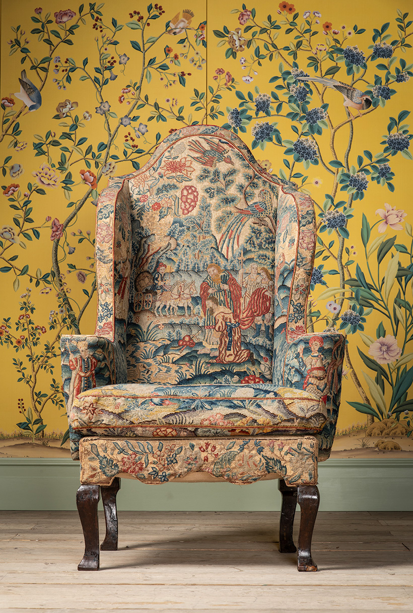 Inline Image - Lot 26: A fine and rare Queen Anne needlework walnut and beechwood wing armchair, circa 1710-1715 | Est.£8,000-12,000 (+ fees) | Lot 559: A set of 'Erdem' Chinoiserie pattern panels hand painted on golden yellow dyed silk, painted and framed by de Gournay | Est. £6,000-8,000 (+ fees)