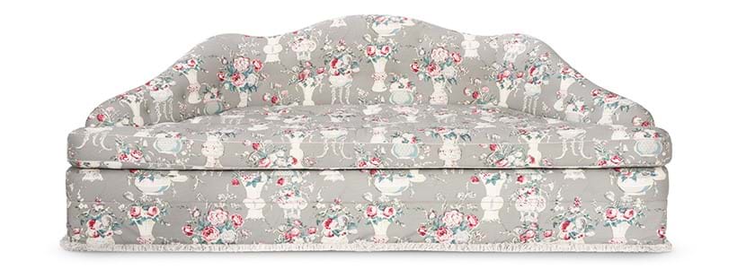Inline Image - A buttoned serpentine backed sofa upholstered in Robert Kime 'Jardinieres' fabric, modern | Est. £1,500-2,500 (+ fees)