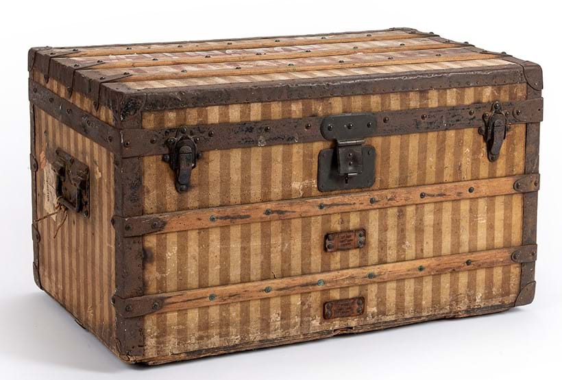 Inline Image - Louis Vuitton, a striped coated canvas hard travelling trunk, 20th century | Sold for £2,772