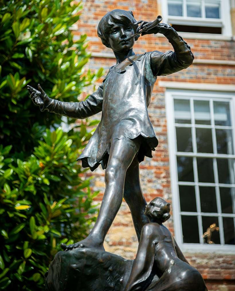 Inline Image - Peter Pan playing his pipe with a fairy looking on
