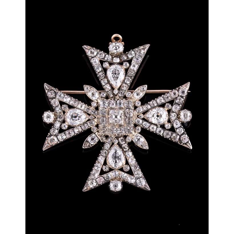 Inline Image - A 19th century diamond Maltese cross brooch, set with pear, cushion and old mine cut diamonds, approximately 6.62 carats total | Sold at Dreweatts for £10,625