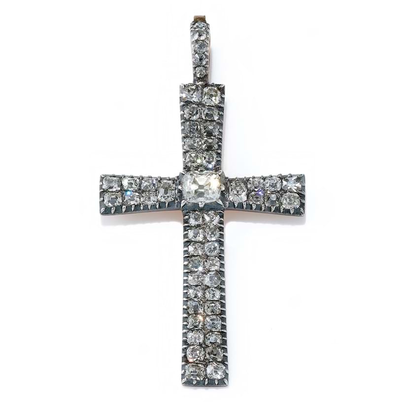Inline Image - A Georgian diamond cross pendant, circa 1800, the central old cushion shaped diamond between slightly tapered arms set with twin rows of old mine cut diamonds | Sold at Dreweatts for £5,292
