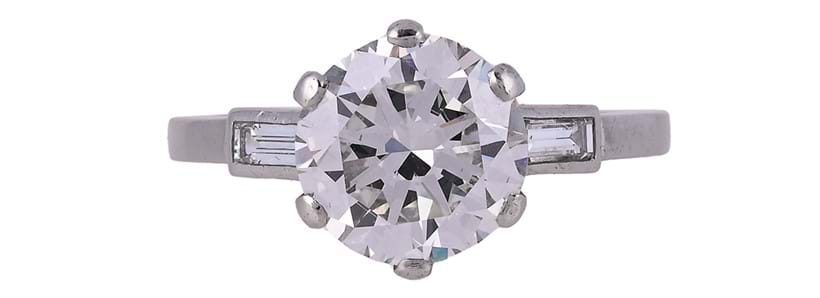 Inline Image - A single stone diamond ring, London 1993, the brilliant cut diamond in a six claw setting, weighing 3.08 carats, to baguette cut diamond shoulders | Sold at Dreweatts for £27,700