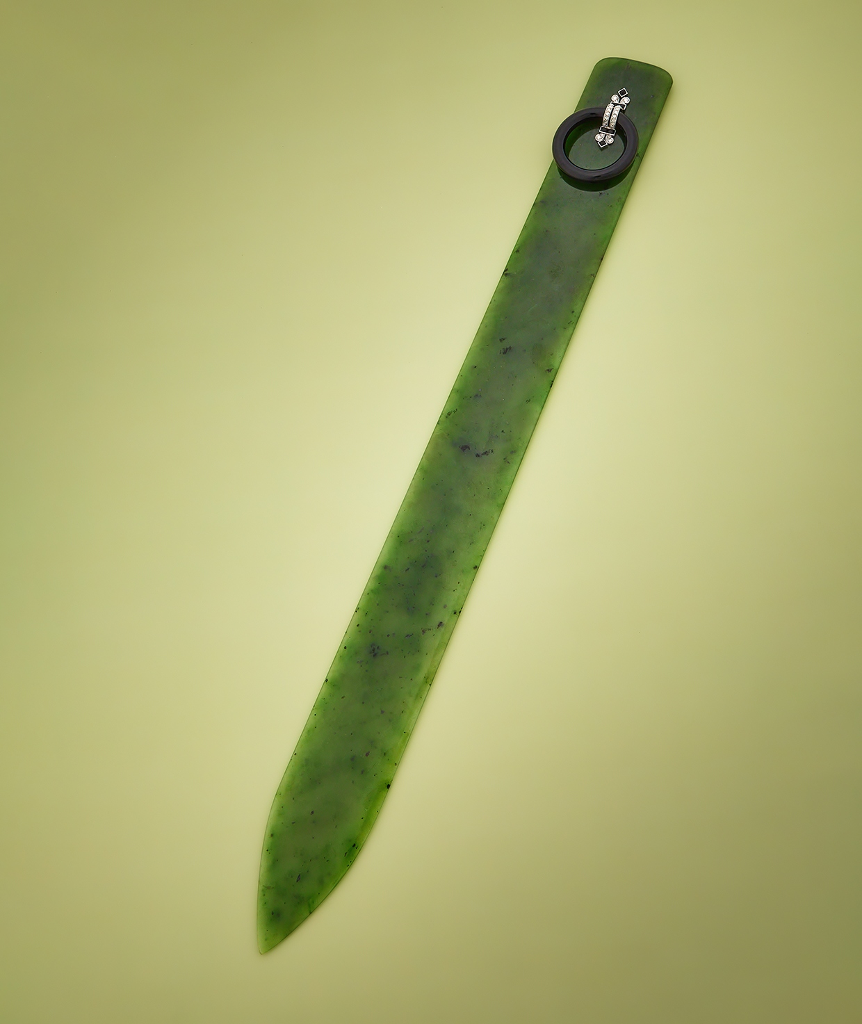 Inline Image - Lot 390: A French Art Deco nephrite, onyx and diamond paper knife, Henri Lafabre, Paris, circa 1920-1925 | Est. £2,000-3,000 (+ fees)