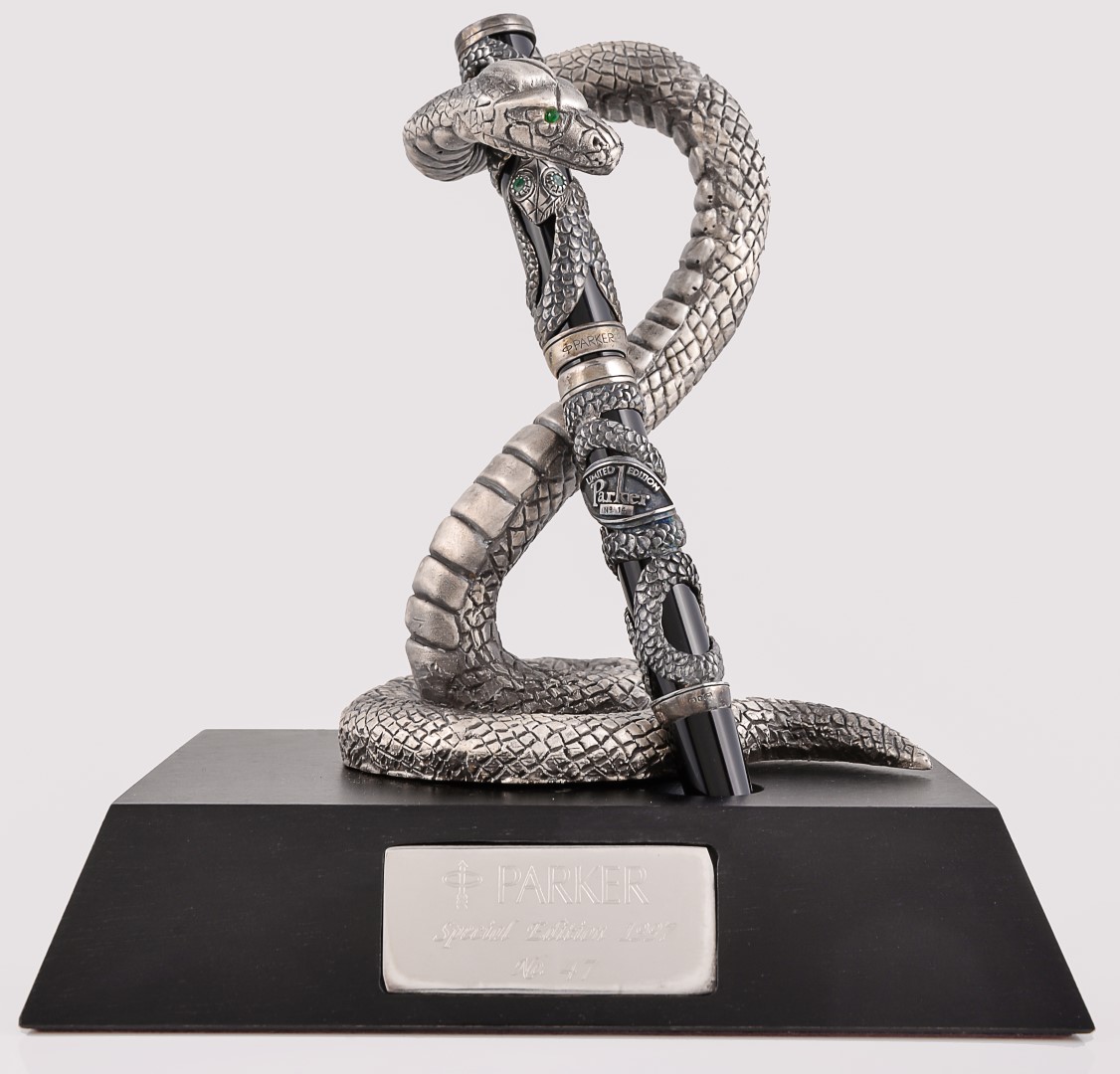 Inline Image - Parker, Snake, limited edition black acrylic and silver mounted fountain pen; est. £500-700 (+fees)  | Parker, Snake, a rare edition limited silver pen stand; est. £300-500 (+fees)