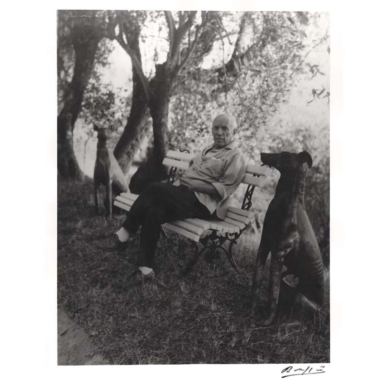 Full length, black and white photograph by Brassai of Picasso, signed by the photographer ('Brassai') in black ink 