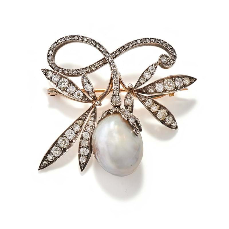 A natural blister pearl and diamond brooch