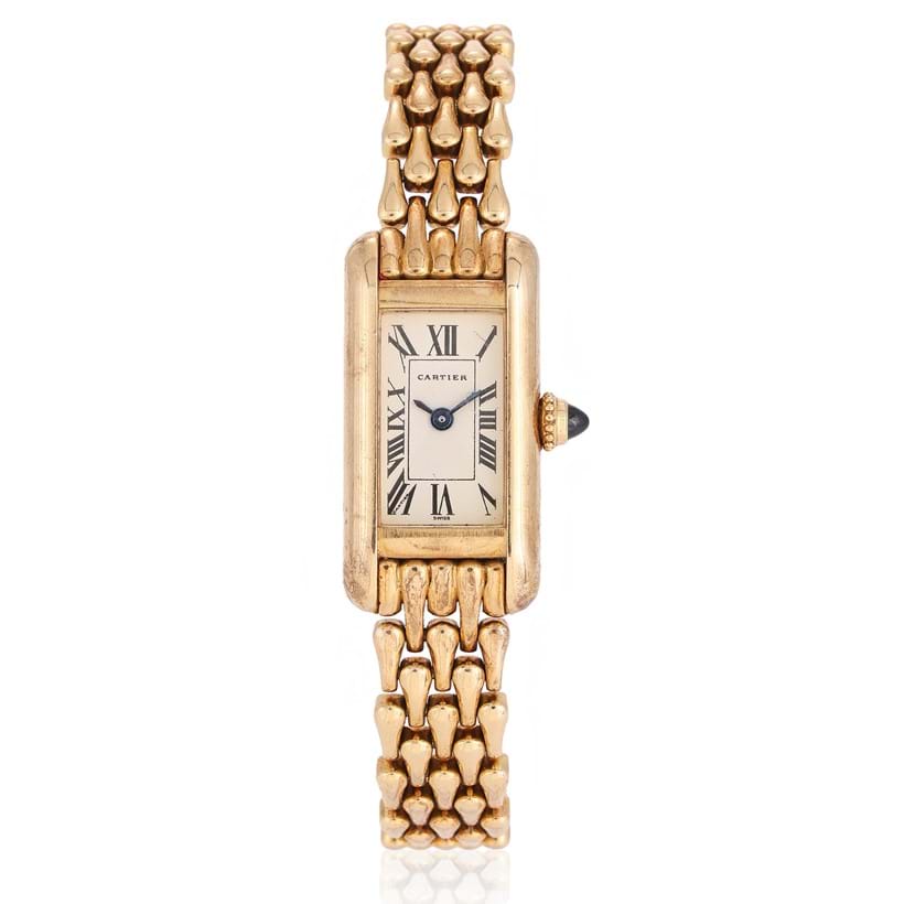 Inline Image - Cartier, Tank Mini Américaine, Ref. 1380, a lady's 18 carat gold bracelet watch, No. C90832, circa 1990 | Sold for 5,670 (June 2024)