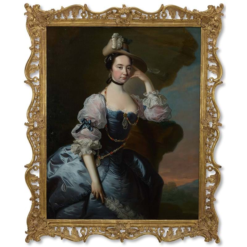 ‡ Thomas Hudson (1701-1779), Portrait of a Lady, Three-quarter-length, in a blue satin dress with lace sleeves, a landscape beyond, oil on canvas