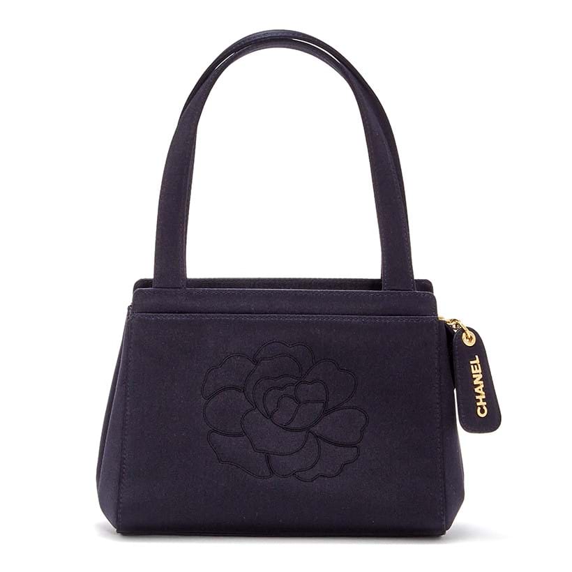 Inline Image - Chanel, Camellia, a black satin evening bag, no. 5634471, circa 1997-1999 | Sold for £1,000
