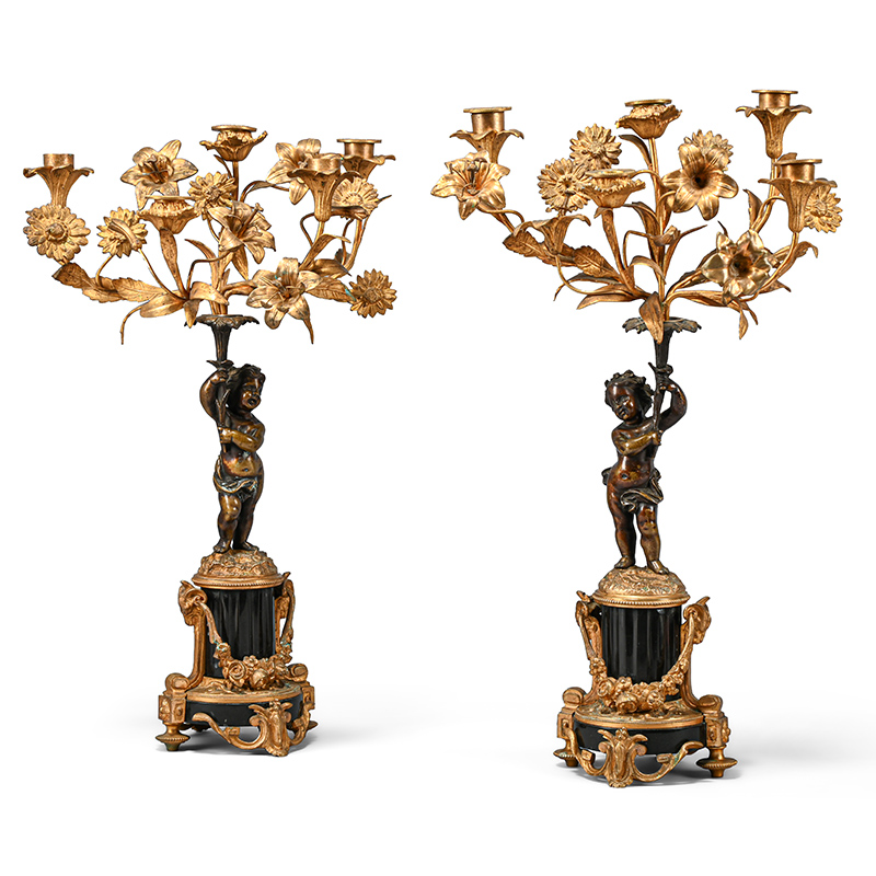 A pair of gilt bronze and white marble figural three light candelabra, French, late 19th century