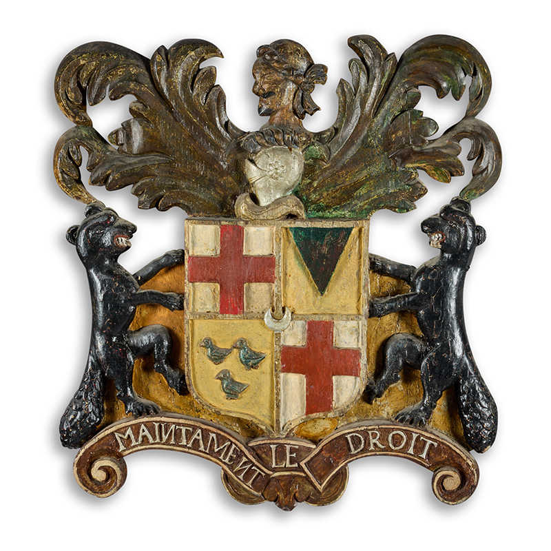 A George I polychrome, parcel gilt, and stained carved oak armorial achievement, first quarter 18th century