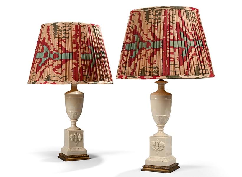 Inline Image - Lot 1193: A pair of gilt metal and cream coloured pottery mounted urns adapted as lamps, 20th century | Est. £300-500 (+ fees)
