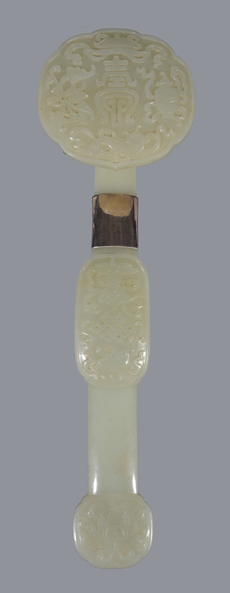 Inline Image - Lot 110, a Chinese celadon jade ruyi sceptre; est. £600-800, sold for £10,625