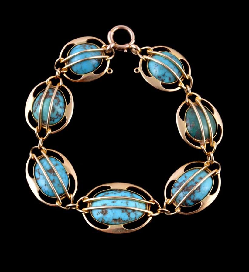 Inline Image - Lot 220, Arts & Crafts turquoise bracelet, by Mürrle Bennett, circa 1905, graduating turquoise in caged settings, stamped 15ct., maker's mark for Murrle Bennett & Co.; est. £500-700 (+fees)